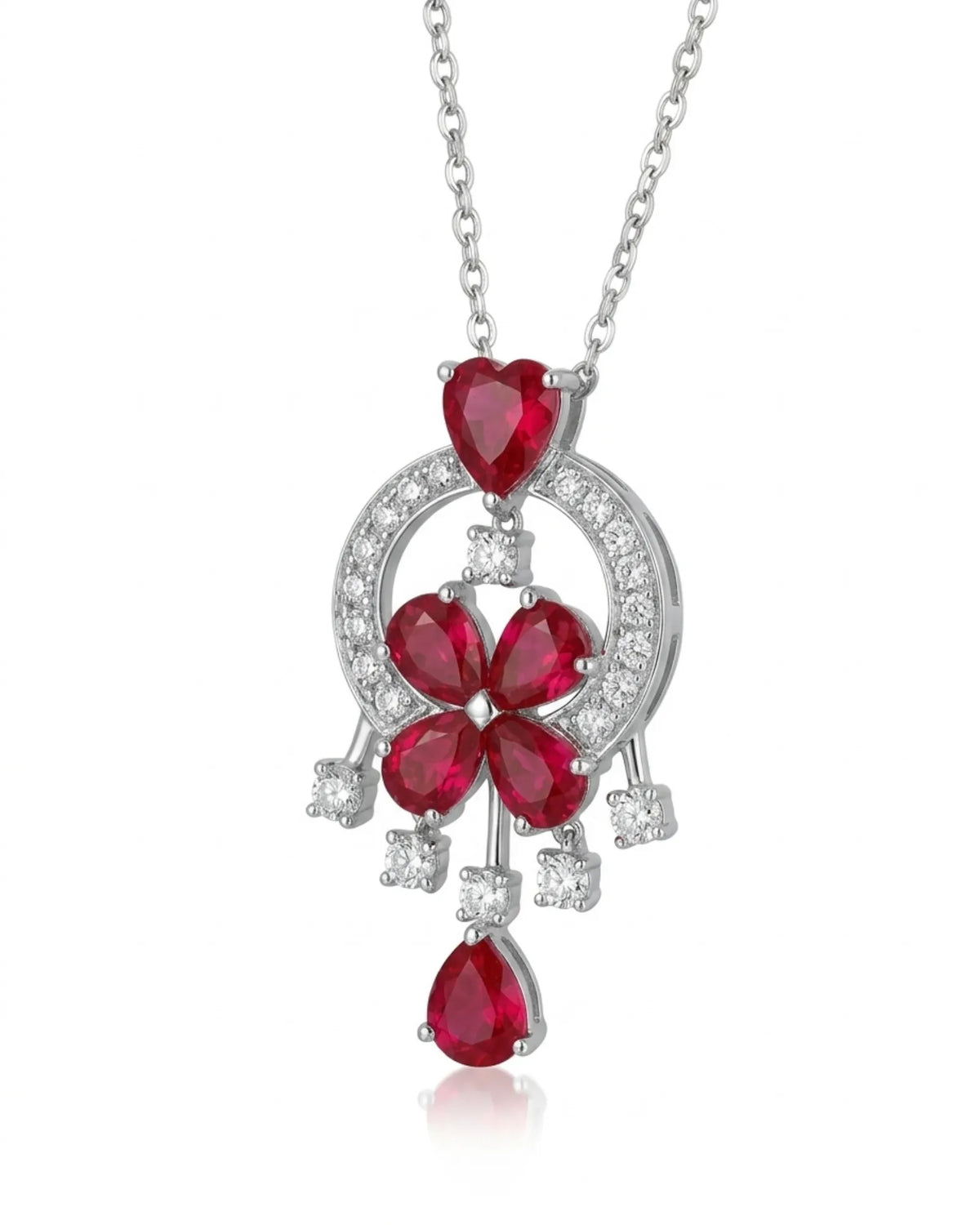 Pigeon blood ruby and diamond platinum pendant worn at the neckline | SARATTI