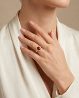 Pigeon blood ruby ring with geometric diamond halo in 18K yellow gold | SARATTI