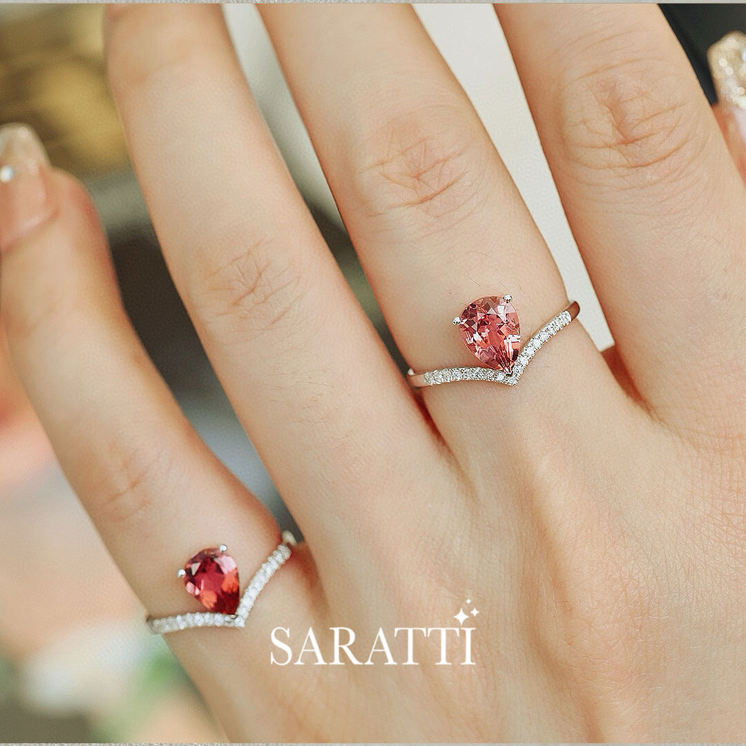 Model wears two of White Gold Teardrop Tiara Pink Tourmaline Engagement Rings | Saratti Fine Jewelry 