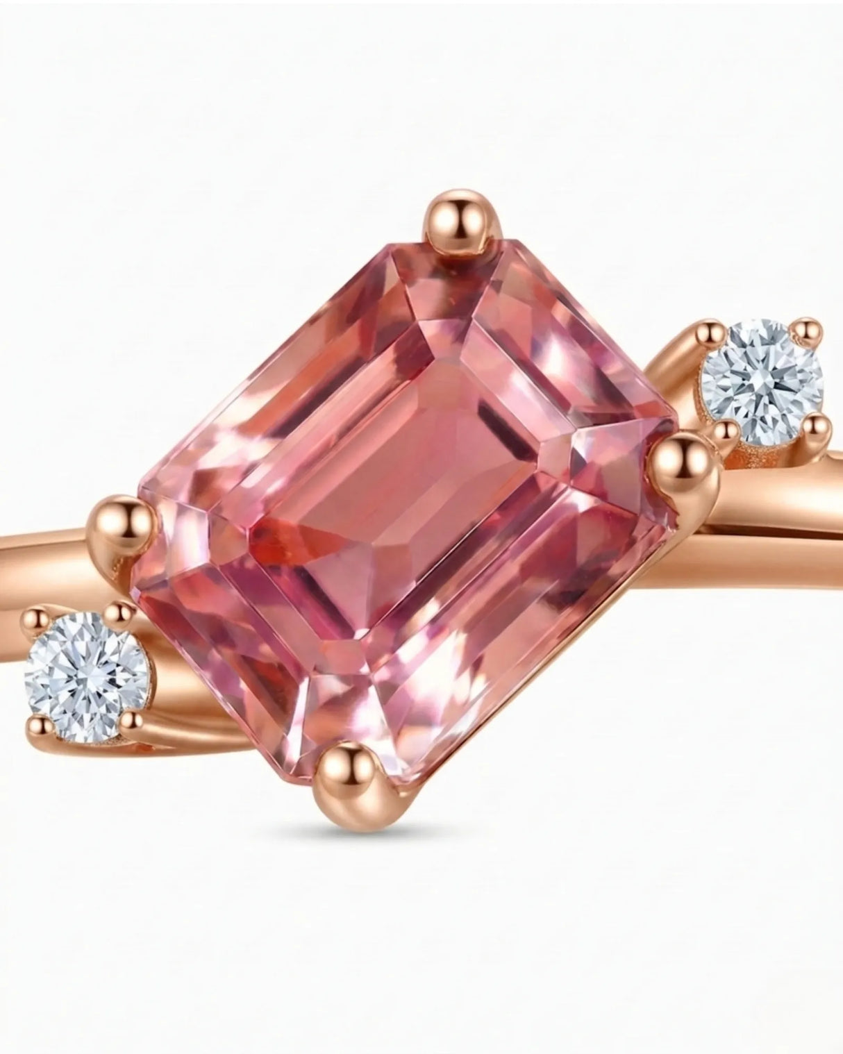 Pink emerald cut tourmaline ring with round diamond side stones in 18K rose gold | SARATTI