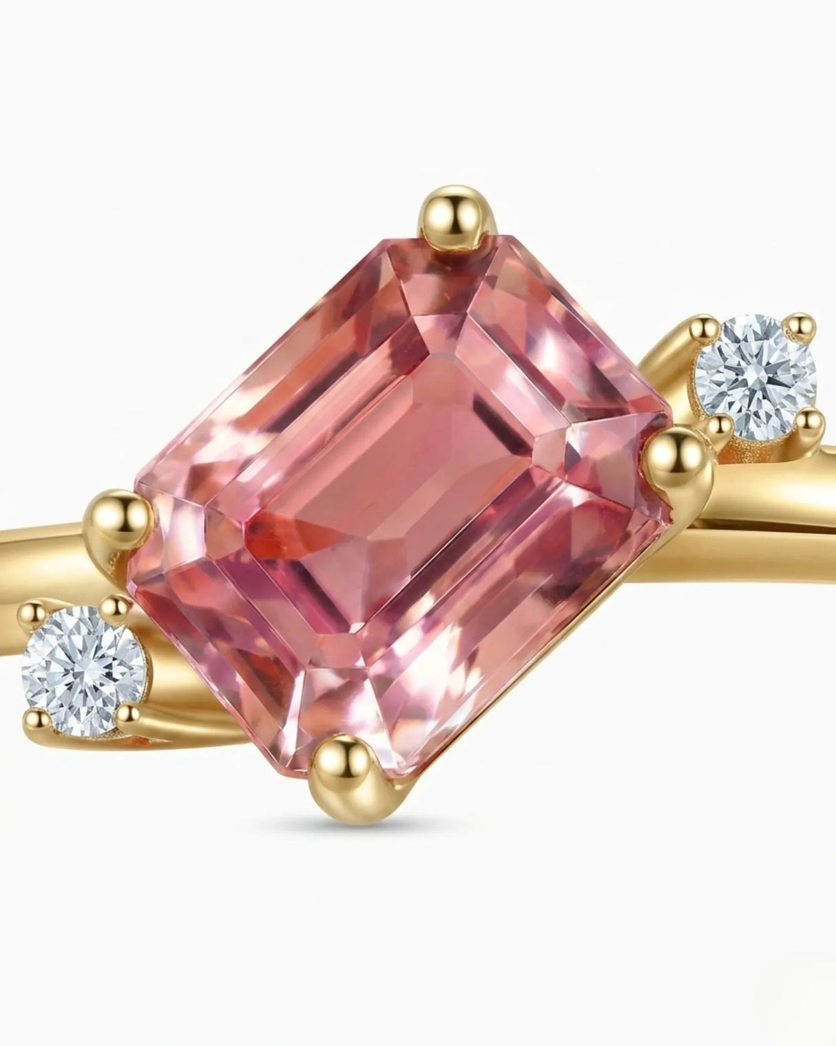 Pink emerald cut tourmaline ring with round diamond side stones in 18K yellow gold | SARATTI