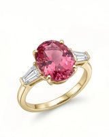 Pink tourmaline ring with oval center stone and emerald-cut diamonds in 18K yellow gold | SARATTI