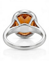Platinum Imperial Topaz oval bezel ring with open shoulders | SARATTI