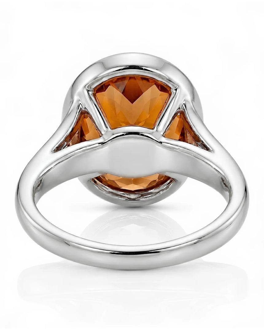 Platinum Imperial Topaz oval bezel ring with open shoulders | SARATTI