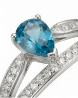 Platinum aquamarine ring with flowing split shank and pavé diamond detail | SARATTI