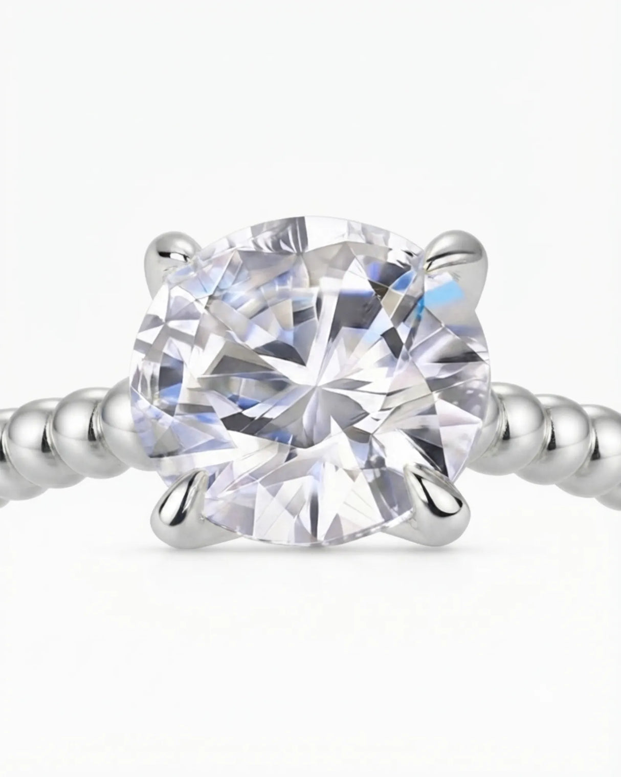 Platinum moissanite engagement ring for a refined proposal with distinctive beaded craftsmanship | SARATTI