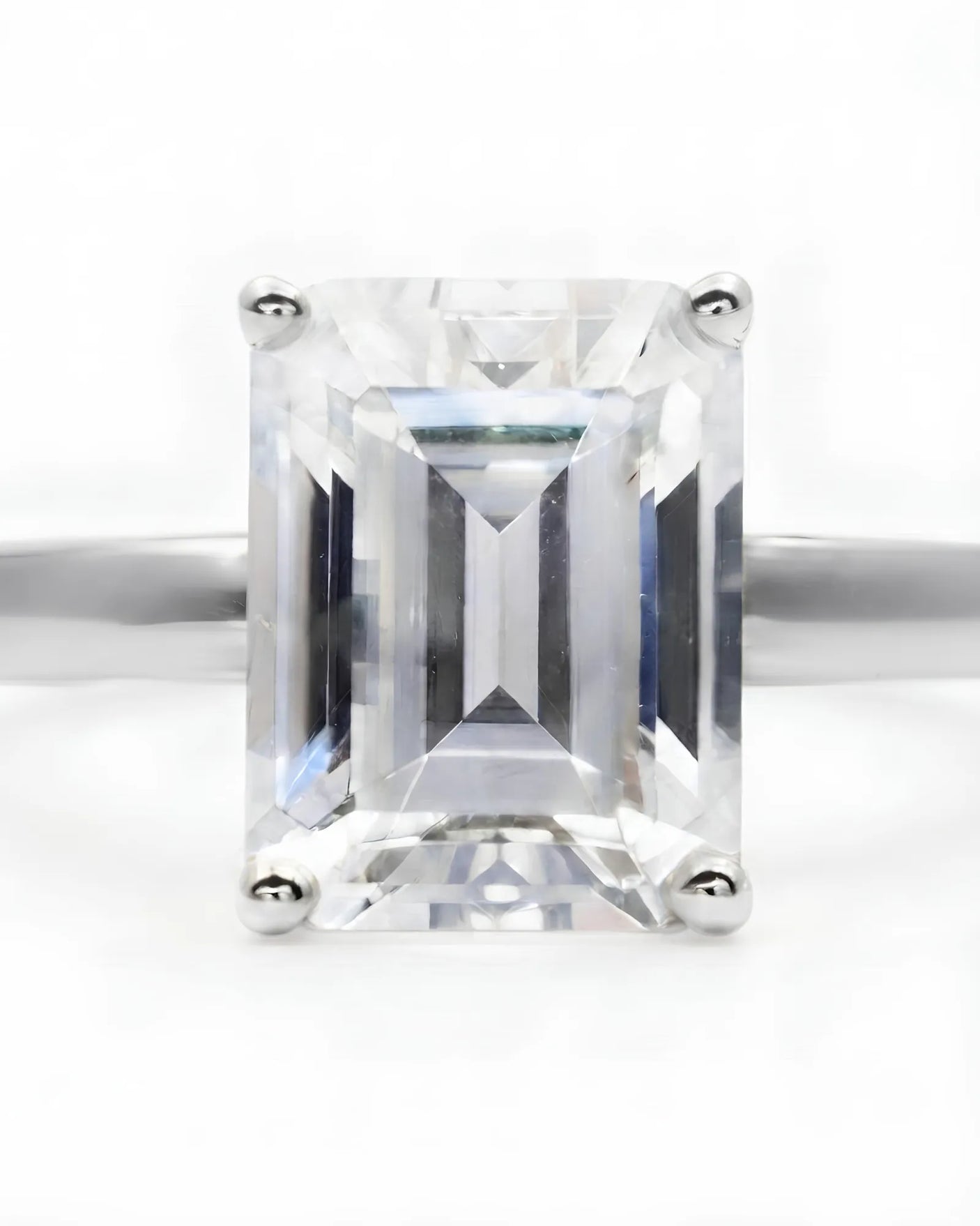 Platinum moissanite engagement ring for a timeless proposal with sophisticated emerald-cut elegance | SARATTI