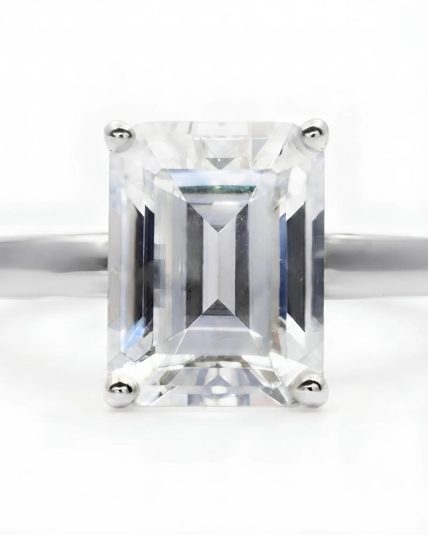 Platinum moissanite engagement ring for a timeless proposal with sophisticated emerald-cut elegance | SARATTI