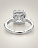 Platinum moissanite ring with cushion center and refined pavé shoulders | SARATTI