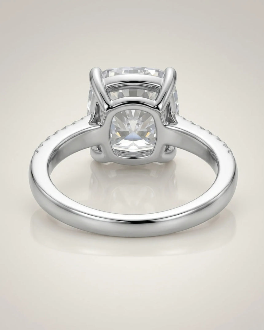 Platinum moissanite ring with cushion center and refined pavé shoulders | SARATTI