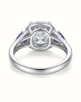 Platinum moissanite ring with cushion center, halo, and tanzanite accents | SARATTI