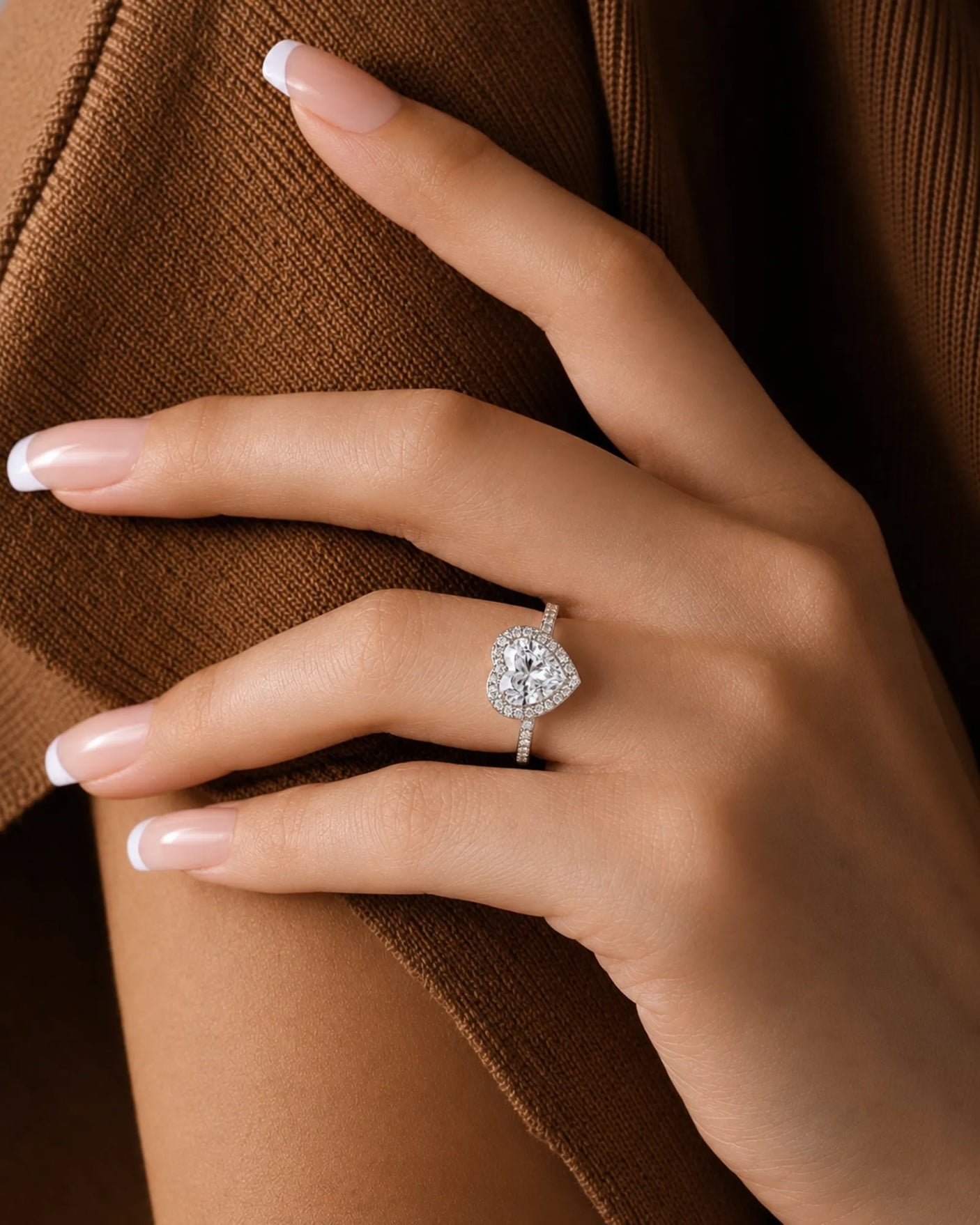 Platinum moissanite ring with romantic heart design and round side stones | SARATTI