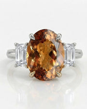 Platinum oval Topaz three-stone setting with sculpted claw prongs | SARATTI