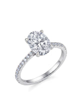 Platinum oval moissanite engagement ring with hidden halo and pavé-set shoulders | SARATTI