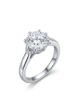 Platinum round moissanite engagement ring with eight-prong floral basket and hidden halo | SARATTI