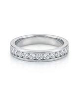 Platinum wedding ring set featuring round natural diamonds channel set around the female full eternity band | SARATTI