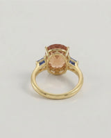 Polished yellow gold Imperial Topaz setting with blue step-cut accents | SARATTI