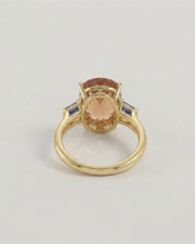 Polished yellow gold Imperial Topaz setting with blue step-cut accents | SARATTI