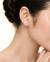 3.00 ct. tw. lab-grown round diamond four-prong studs in 18K rose gold, prong detail | SARATTI