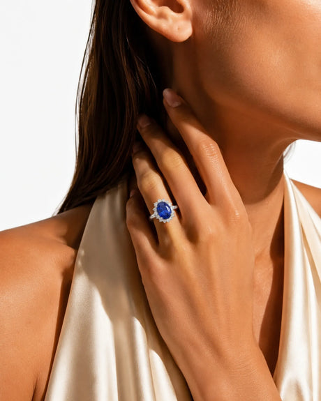 Princess Diana-inspired sapphire ring with classic diamond halo in white gold | SARATTI