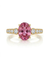 Purple oval sapphire engagement style ring with diamond shoulders in polished 18K yellow gold | SARATTI