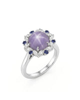 Purple star sapphire ring with marquise diamond halo in 18K white gold | SARATTI