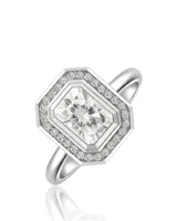 Radiant cut moissanite halo ring in 18K white gold with geometric bezel-style frame | SARATTI