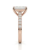 Radiant moissanite center stone ring with round side stones in rose gold | SARATTI