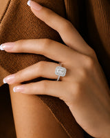 Radiant moissanite ring in white gold with four-prong center and structured halo | SARATTI