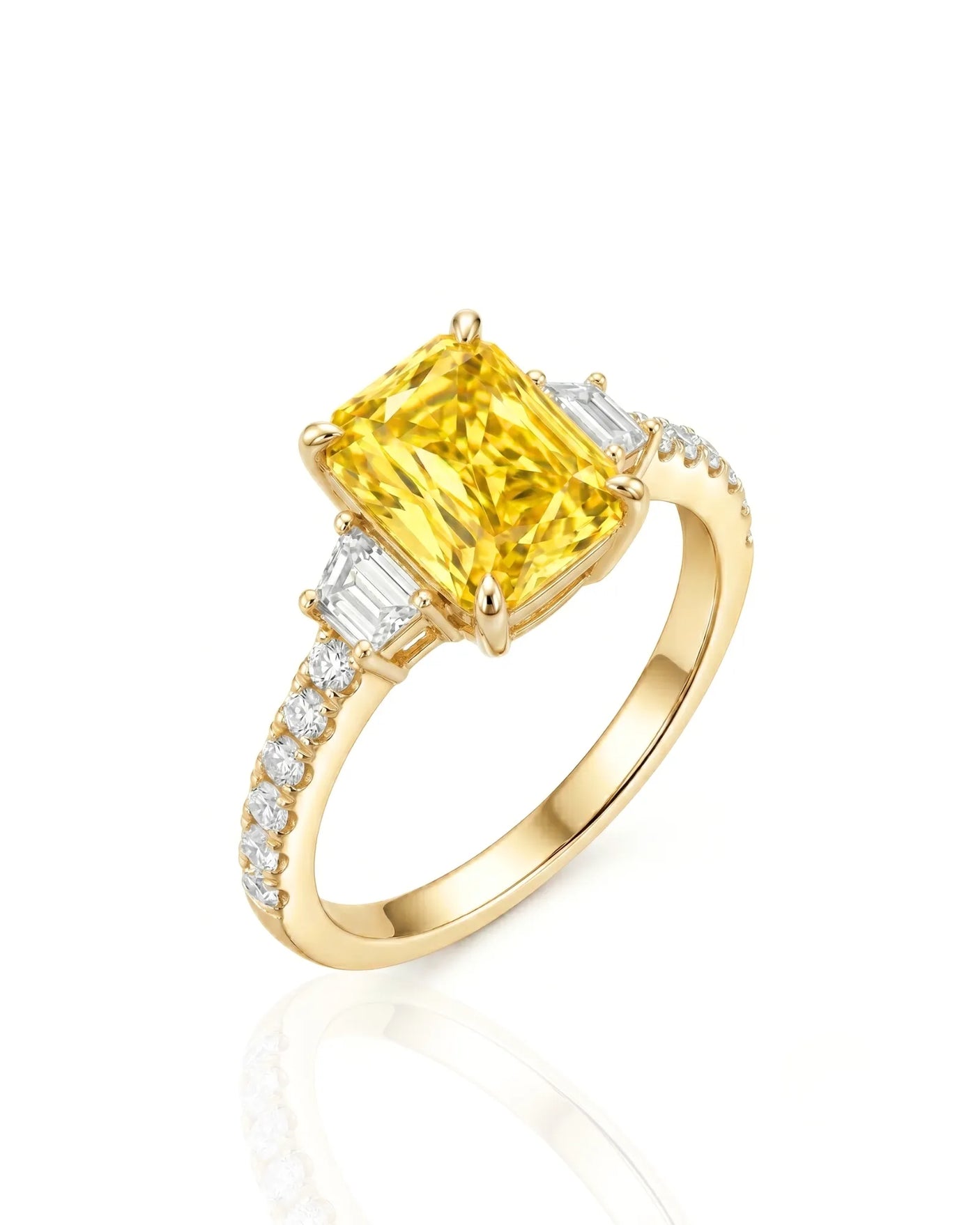 Radiant yellow sapphire ring with round and trapezoid diamonds in 18K yellow gold | SARATTI