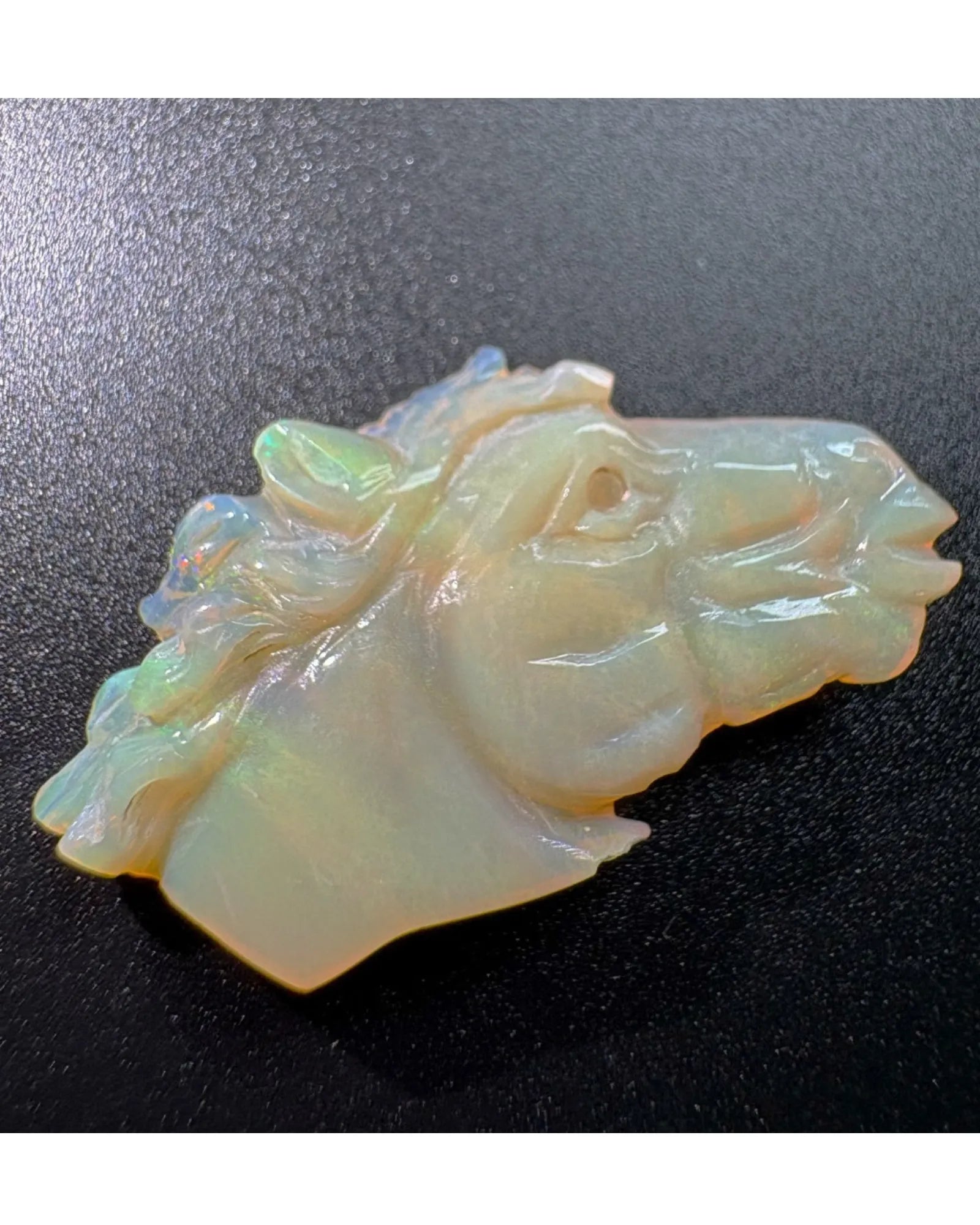 Rear three-quarter view of 12.9ct carved White Opal horse | SARATTI
