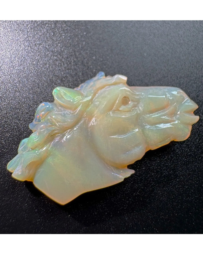 Rear three-quarter view of 12.9ct carved White Opal horse | SARATTI