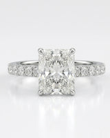 Rectangular radiant-cut natural diamond ring accented by pavé diamonds in refined polished platinum | SARATTI