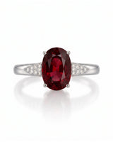 Red garnet engagement ring with tapered diamond shoulders in 18K white gold | SARATTI