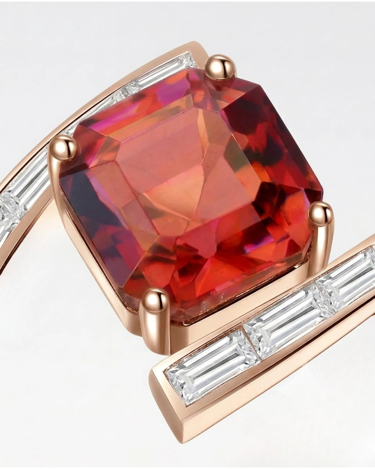 Red tourmaline engagement ring with curved baguette diamond band in 18K rose gold | SARATTI