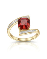 Red tourmaline engagement ring with curved baguette diamond band in 18K yellow gold | SARATTI