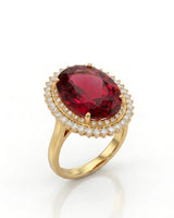 Red tourmaline ring with oval center stone and double diamond halo in 18K yellow gold | SARATTI