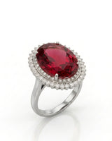 Red tourmaline ring with oval center stone and double diamond halo in polished platinum | SARATTI