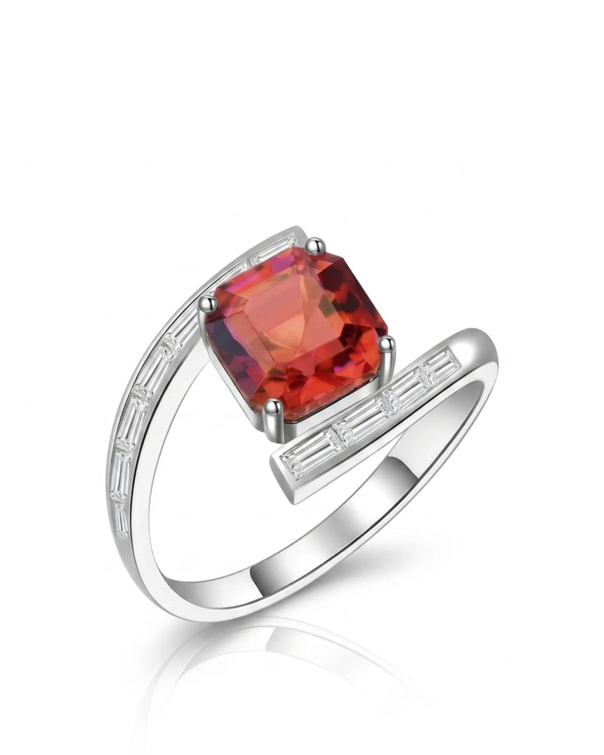 Reddish pink tourmaline ring with geometric center stone and baguette diamonds in polished platinum | SARATTI