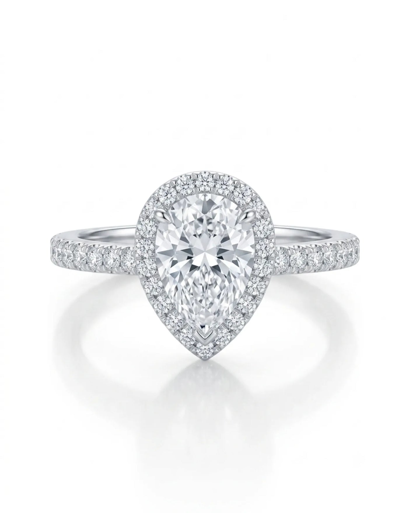 Refined teardrop moissanite ring with elevated halo setting and slender platinum band | SARATTI