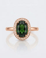 Rich forest green oval tourmaline ring framed by natural diamonds in 18K rose gold | SARATTI