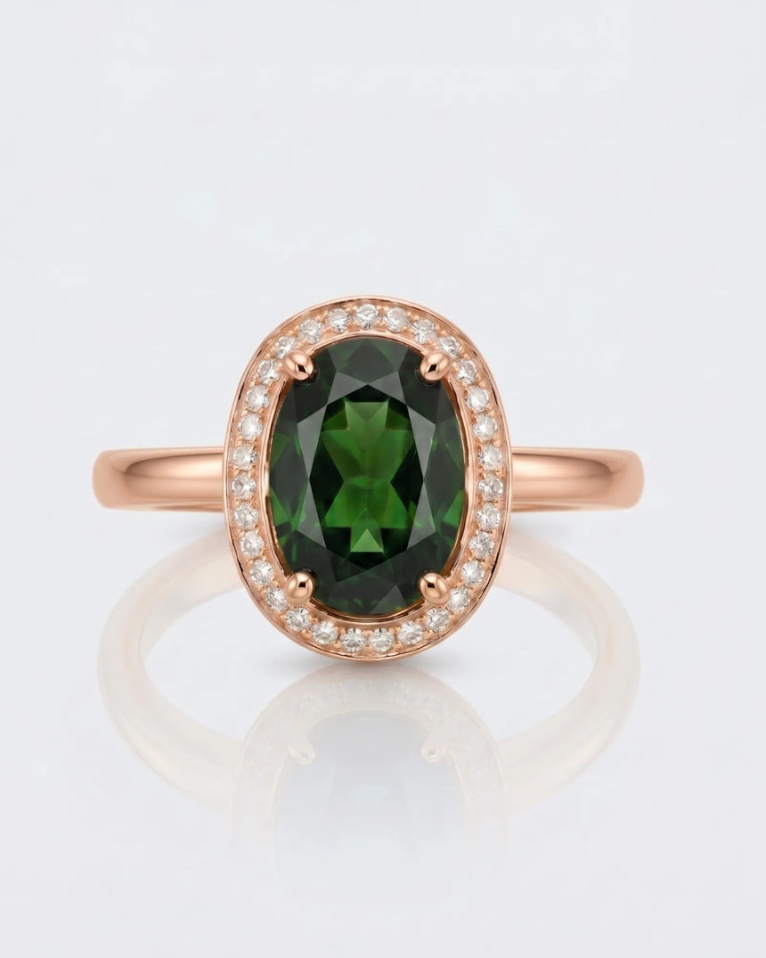 Rich forest green oval tourmaline ring framed by natural diamonds in 18K rose gold | SARATTI