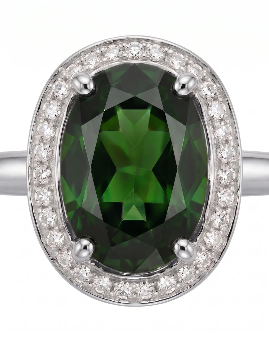 Rich forest green oval tourmaline ring framed by natural diamonds in platinum | SARATTI