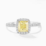 Ring with a yellow diamond and diamond-studded band on a white background - SARATTI