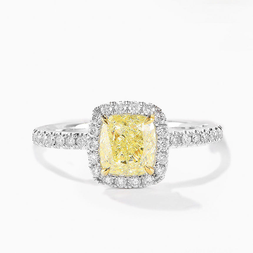 Ring with a yellow diamond and diamond-studded band on a white background - SARATTI