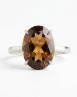 Romantic Imperial Topaz engagement ring featuring an oval center and refined 18K rose gold band - SARATTI