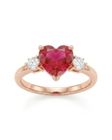 Romantic heart-shaped ruby ring with two diamond side stones in 18K Rose Gold | SARATTI