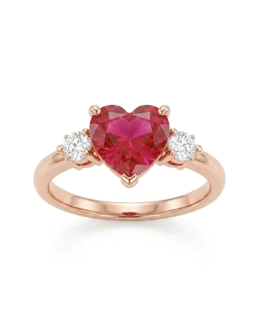 Romantic heart-shaped ruby ring with two diamond side stones in 18K Rose Gold | SARATTI