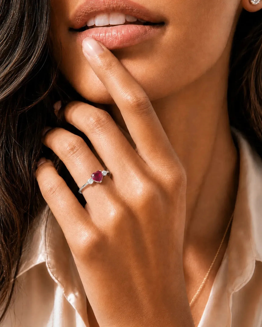 Romantic heart-shaped ruby ring with two diamond side stones in 18K White Gold | SARATTI