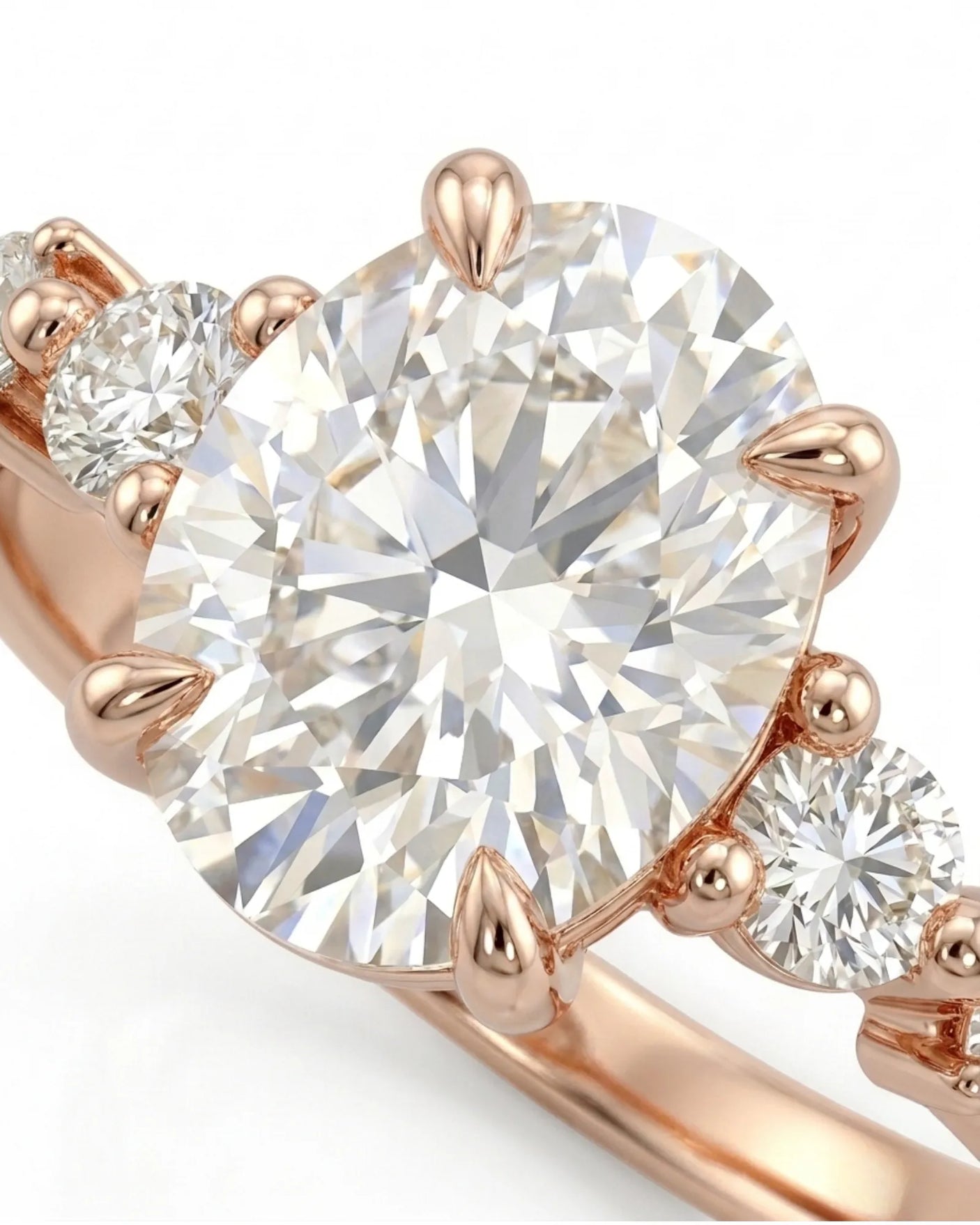 Romantic oval diamond ring with flowing round side stones and high-polish 18K rose gold band | SARATTI